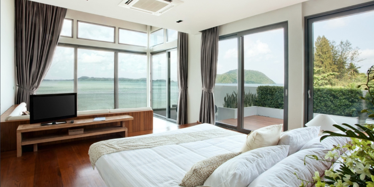 Imagen de dormitorio con ventanas aislantes Climalit
